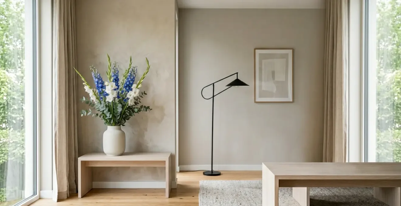 Modern living room interior showcasing dramatic tall floral arrangement transforming the space ambiance