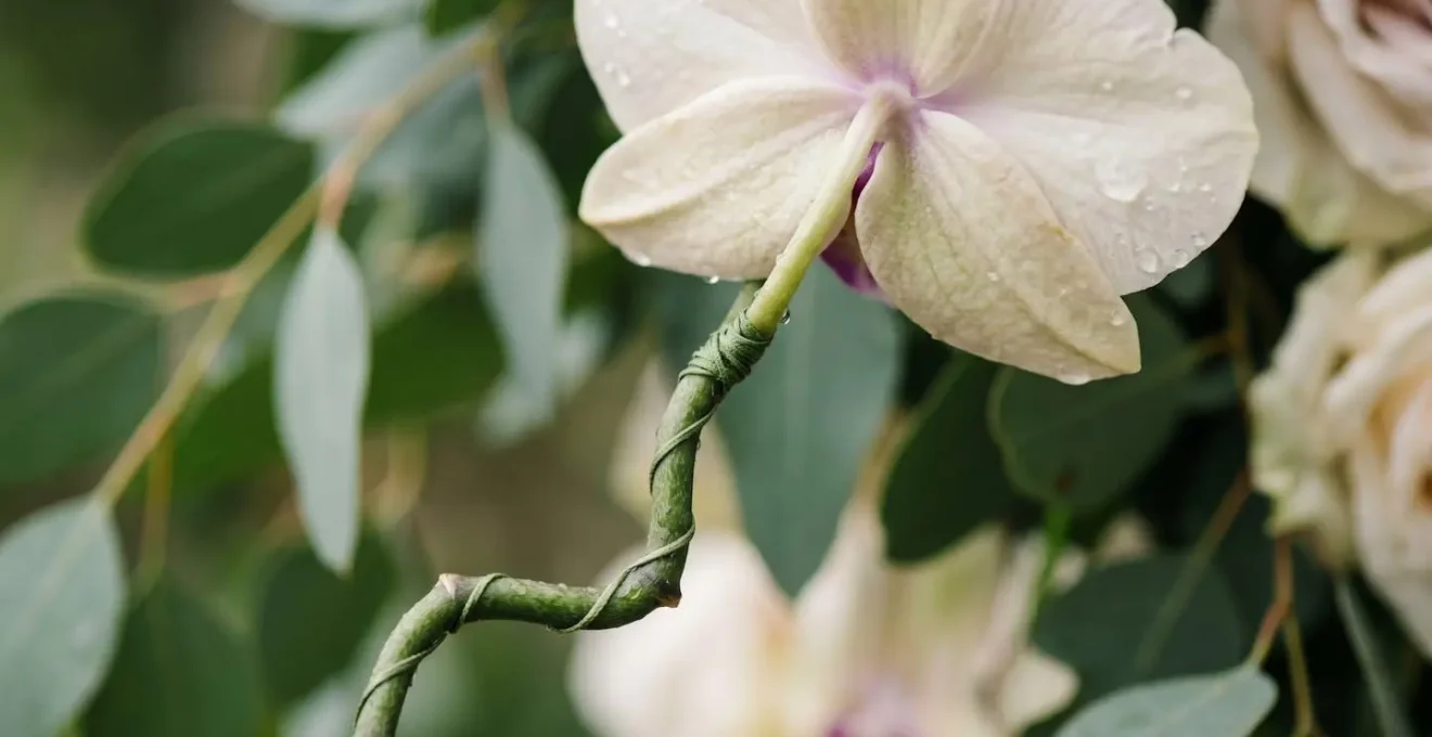 Macro detail showing pre-curved wiring technique that allows natural movement in cascade bouquet flowers
