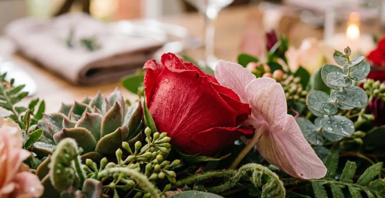 Low horizontal flower runner arrangement allowing clear sightlines across table